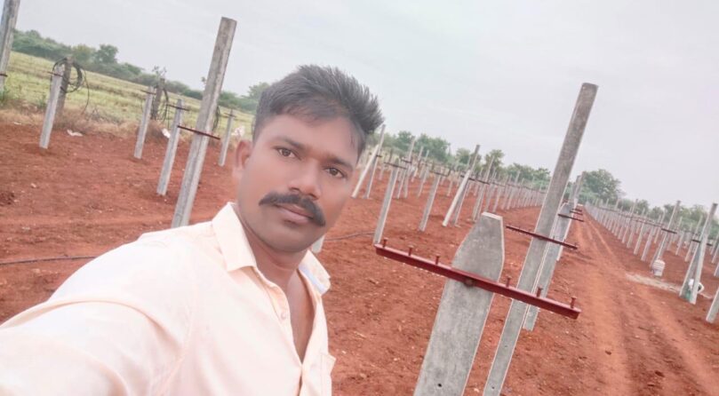 Mr Chandu with his draogn farm in the background